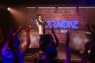 Karaoke show with performer and cheering guests in The Loft on MSC World America | MSC Cruises