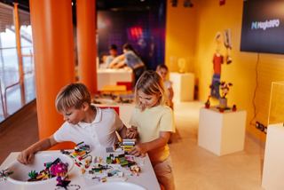Children enjoy building toys in the family entertainment area on a cruise ship | MSC Cruises