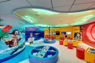 Junior club with LEGO theme, colorful seating and play area aboard MSC Seaview | MSC Cruises