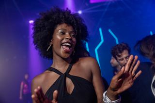 A group dances and enjoys vibrant entertainment at MSC Luna Park Arena on board | MSC Cruises
