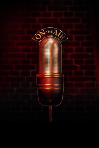 Microphone on a dark background with red tones, evoking a musical performance | MSC Cruises