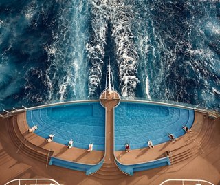 Aerial view of the Infinity Pool on MSC Seashore with foam and guests along the deck | MSC Cruises