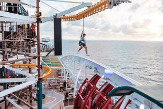 Guests enjoy a ropes course overlooking the sea on board a cruise ship | MSC Cruises