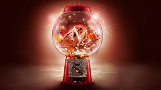 Red gumball machine filled with colorful candies and illuminated background glow | MSC Cruises