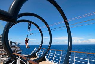 An exhilarating zip line adventure on the deck overlooking the sea and vibrant blue sky | MSC Cruises