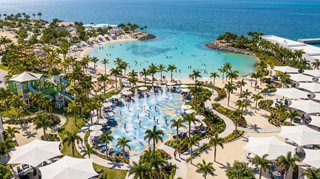 A tropical island with a pool, palm trees and turquoise water offers tranquil relaxation | MSC Cruises