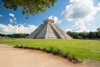 The pyramid at Chichen Itza stands on lush grass beneath a bright blue sky in Mexico | MSC Cruises