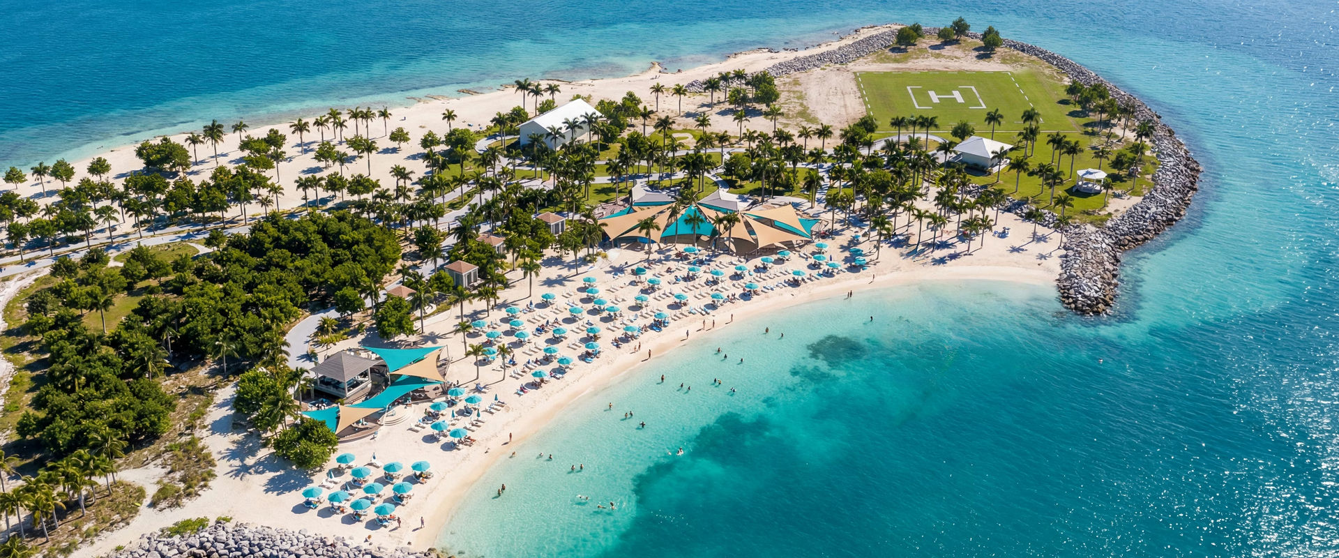 Turquoise sea and white sand surround an island with greenery and resort amenities | MSC Cruises