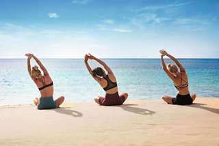 Yoga class on the beach | MSC Cruises