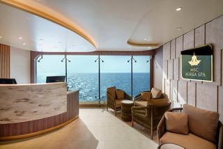 Aurea Spa front desk on MSC Poesia featuring expansive sea views through floor-to-ceiling windows | MSC Cruises