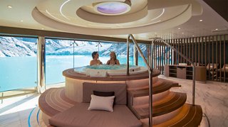 Guests enjoy a hot tub with stunning sea views aboard a luxurious cruise ship | MSC Cruises