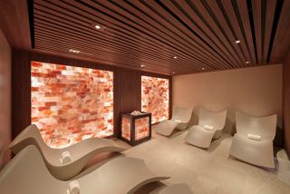 Salt room with loungers and a calming ambiance in the MSC Poesia thermal area | MSC Cruises