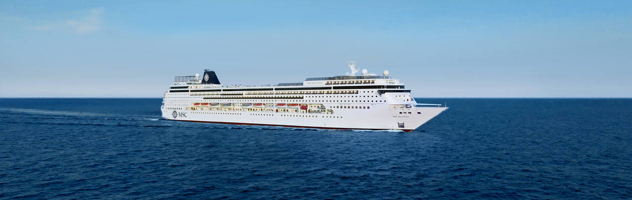 MSC Sinfonia cruise ship sails across the calm blue sea under a clear sky | MSC Cruises