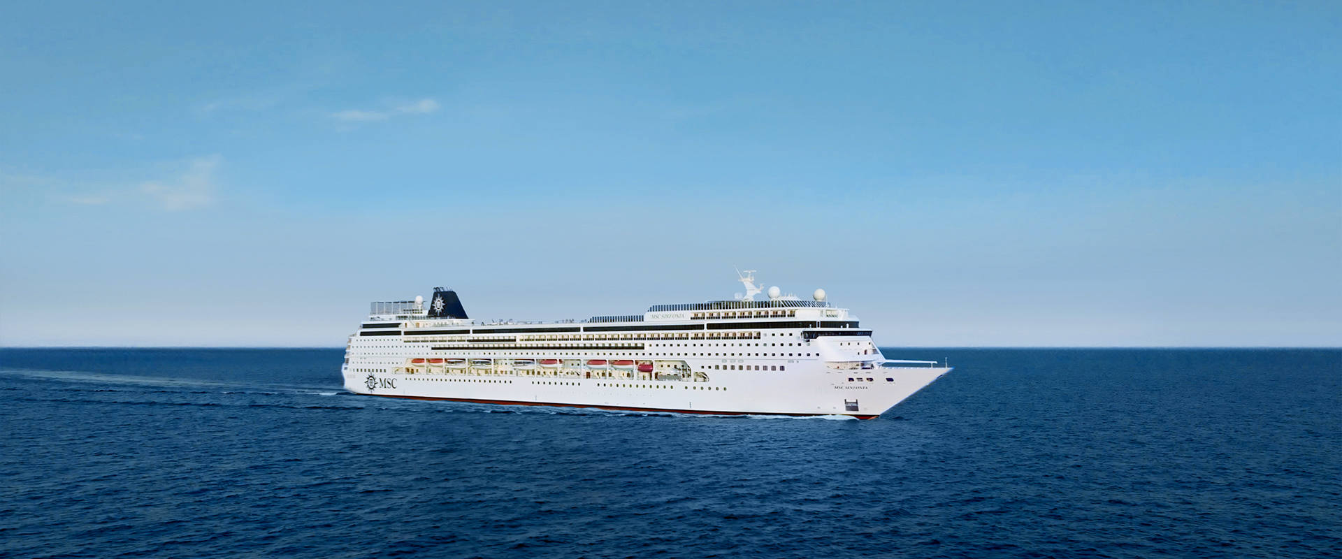 MSC Sinfonia cruise ship sails across the calm blue sea under a clear sky | MSC Cruises