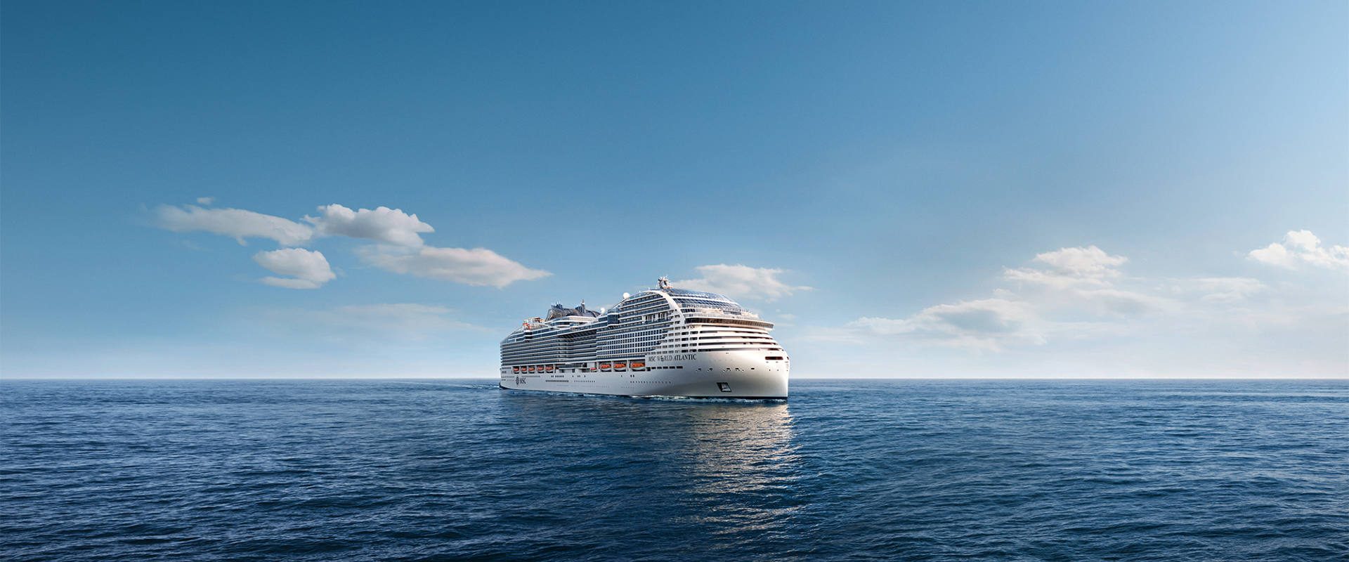 A cruise ship sails across calm blue waters under a clear sky | MSC Cruises