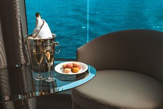 2 glasses of champagne & macarons on board a MSC Cruise