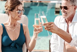 Couple cheering with champagne on board a MSC Cruise