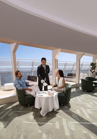 A couple enjoys tea served by a butler in an elegant lounge overlooking the sea | MSC Cruises
