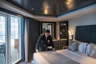 Suite with balcony, bed and butler service in MSC Yacht Club on MSC World Europa | MSC Cruises