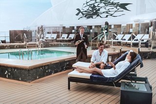 Relaxing at the pool with butler service and champagne at MSC Yacht Club | MSC Cruises