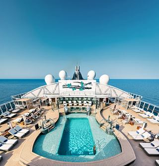 Sun deck with pool on a cruise ship surrounded by endless blue sea | MSC Cruises