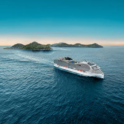 Cruise ship travels toward islands across a calm blue sea under a clear sky | MSC Cruises
