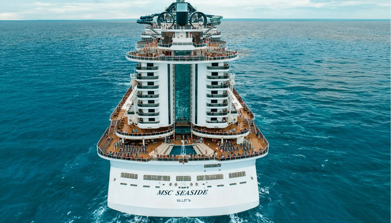 MSC Seaside cruise ship sails across tranquil blue ocean waters | MSC Cruises