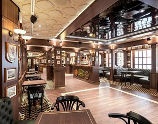 A welcoming bar interior with wooden decor and cozy seating, perfect for relaxation and socialising | MSC Cruises