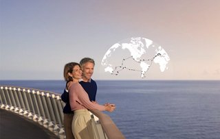 A couple enjoys the sea view from the deck of a cruise ship | MSC Cruises