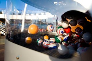 Guests enjoying a vibrant outdoor bingo game on the deck of MSC Splendida, highlighting fun on board | MSC Cruises
