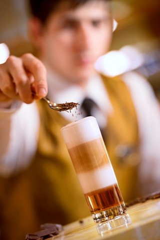 A bartender skillfully preparing a drink at the bar on MSC Preziosa, showcasing exceptional service and attention to detail | MSC Cruises