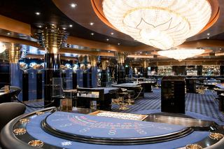A vibrant casino area aboard MSC Magnifica featuring gaming tables and an inviting atmosphere for entertainment | MSC Cruises