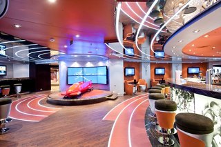 A vibrant interior of the L'Olimpiade Sporting Bar on MSC Magnifica, featuring a welcoming atmosphere and sports memorabilia | MSC Cruises
