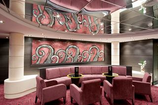 The Ruby Bar on MSC Magnifica features elegant seating and artistic decor for a relaxing atmosphere | MSC Cruises