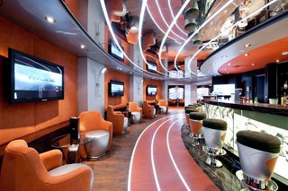 A stylish bar area with comfortable seating and a welcoming atmosphere aboard MSC Magnifica | MSC Cruises