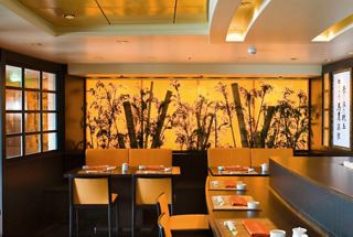 Kaito Sushi Bar interior featuring a warm ambiance with counter seating and decorative wall elements | MSC Cruises