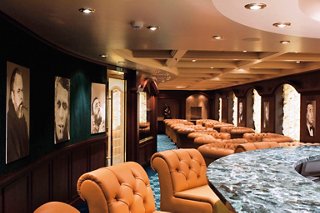A sophisticated cigar room on MSC Musica featuring plush seating and elegant decor | MSC Cruises