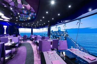 A vibrant dining area in the Galaxy Lounge with stunning ocean views and modern seating arrangements | MSC Cruises