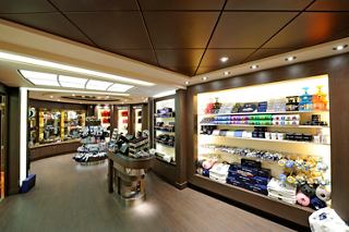 A vibrant shop interior on MSC Preziosa showcasing a variety of merchandise for guests to explore and enjoy | MSC Cruises