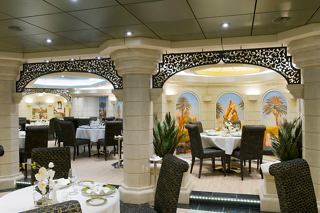 Elegant dining setup in the MSC Yacht Club restaurant with tasteful decor and inviting atmosphere | MSC Cruises