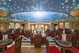 A vibrant dining area in the Phoenician Plaza with elegant seating and a beautifully designed ceiling | MSC Cruises