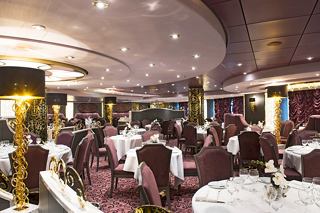 Elegant dining setting at L'Arabesque Restaurant onboard MSC Preziosa, inviting guests to enjoy exquisite meals together | MSC Cruises