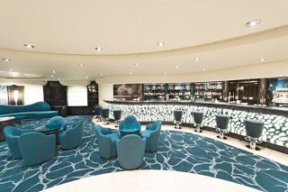 A welcoming bar area with stylish seating and a modern design on MSC Preziosa | MSC Cruises