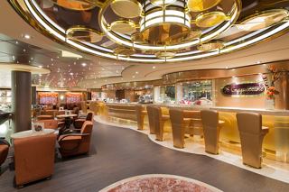 A warm and inviting bar area featuring elegant seating and a stylish counter on MSC Preziosa | MSC Cruises