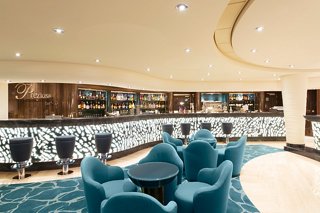 A stylish bar area featuring comfortable seating and a welcoming atmosphere for relaxation and socialising | MSC Cruises