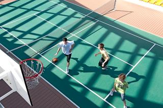 Teenagers enjoying a game of basketball on the deck of MSC Splendida, fostering friendship and fun together | MSC Cruises