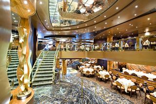 A welcoming view of La Reggia Restaurant featuring elegant seating and stunning decor aboard MSC Splendida | MSC Cruises