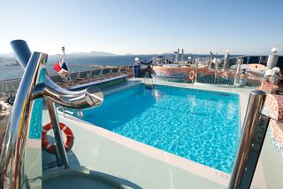 A serene pool area with stunning sea views on the deck of MSC Splendida | MSC Cruises