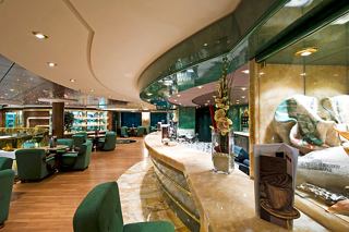 A welcoming view of L'Espresso Coffee Bar on MSC Splendida, featuring a bar counter and comfortable seating | MSC Cruises