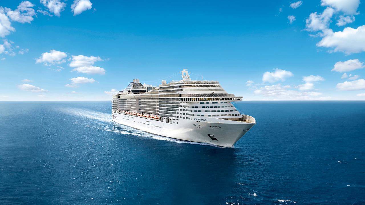 Luxury cruise ship sailing on open sea at sunset | MSC Croisières